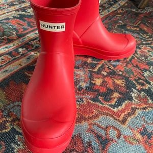 Red Hunter boots. Worn one time from home to work.  Realized they are too big.